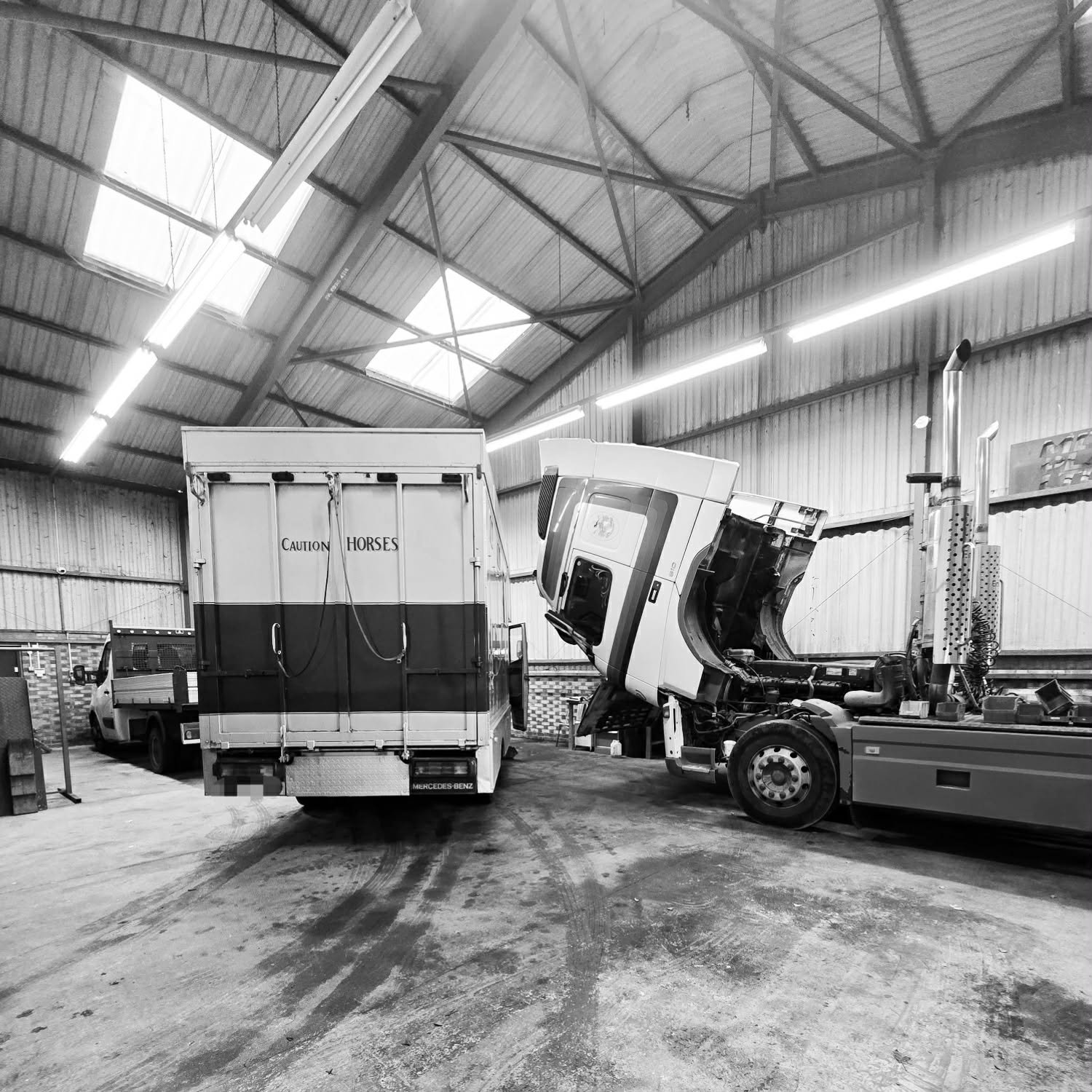 Commercial vehicles inside the Coopers Commercials workshop